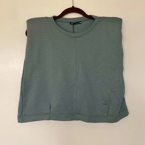 light green, padded shoulder crop top